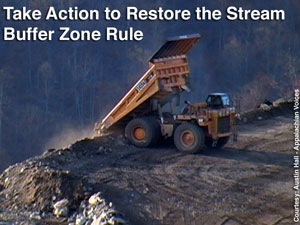 Dumping mine waste into a valley fill on Kayford Mountain, WV - by Austin Hall of Appalachian Voices